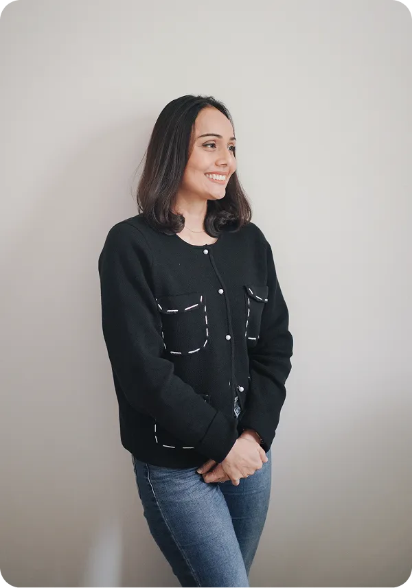 Shabnam Lee standing and smiling